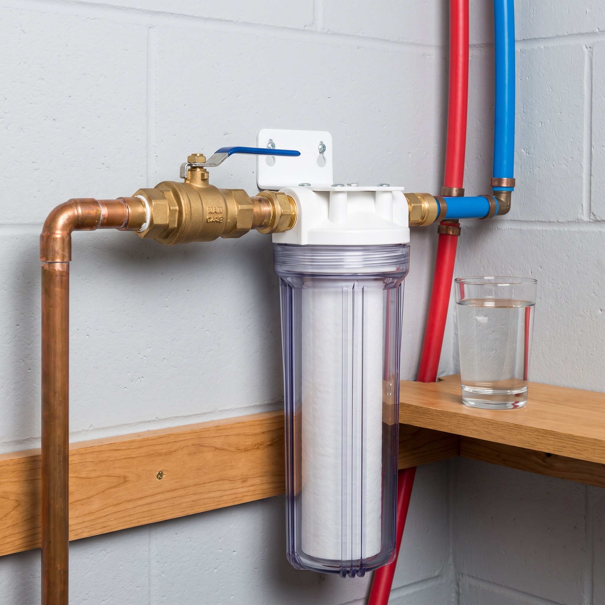 Older Colorado home plumbing showing mineral buildup where copper pipe meets newer PEX connection